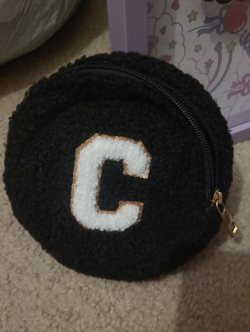 Black Round Sherpa Pouch with White 'C' Patch